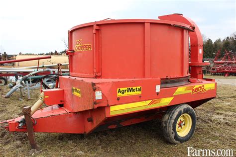 skid steer feeding cows hay|Tub Grinders & Bale Processors For Sale .